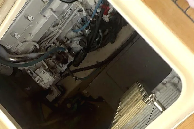 Caroline Kai Yacht Photos Pics Engine compartment of a 2016 Sea Ray 510 Fly yacht, showcasing mechanical components.