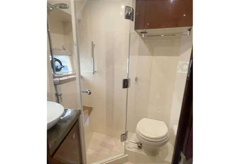 Caroline Kai Yacht Photos Pics Luxurious bathroom in 2016 Sea Ray 510 Fly yacht with modern fixtures and glass shower.
