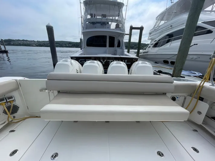  Yacht Photos Pics 2017 Boston Whaler 420 Outrage boat docked, featuring spacious seating and powerful engines.