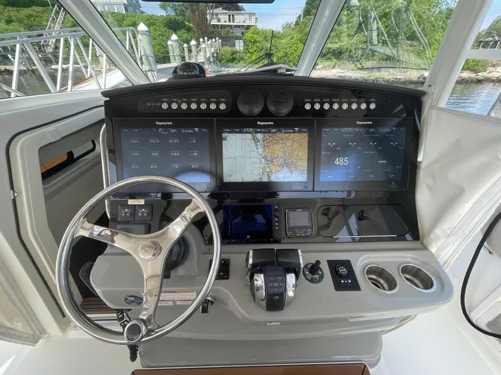  Yacht Photos Pics 2017 Boston Whaler 420 Outrage helm with advanced navigation displays and controls.