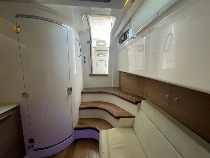  Yacht Photos Pics Interior of 2017 Boston Whaler 420 Outrage, featuring sleek design and wooden accents.