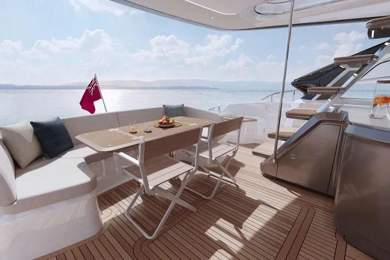  Yacht Photos Pics Manufacturer Provided Image: Luxurious 2025 Princess S65 yacht deck with seating, table, and ocean view.