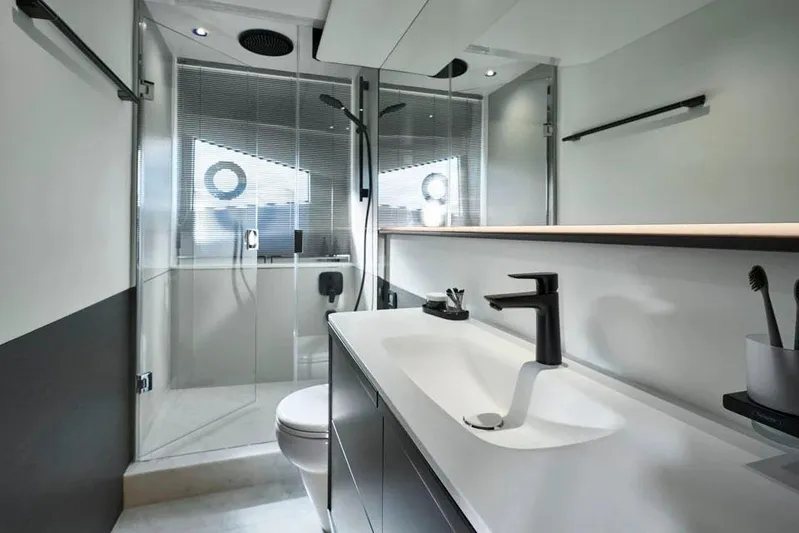  Yacht Photos Pics Manufacturer Provided Image: Luxurious bathroom in 2025 Princess S65 yacht, featuring modern fixtures and sleek design.