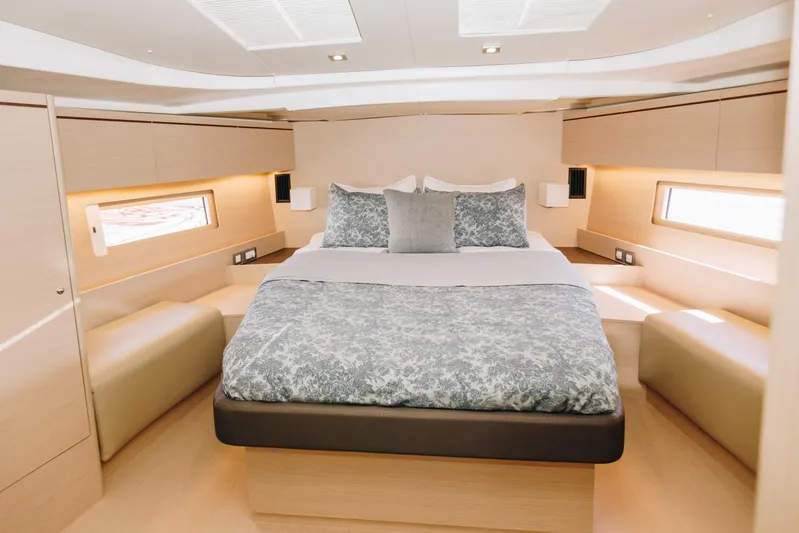  Yacht Photos Pics Luxurious cabin interior of 2024 Beneteau Oceanis 51.1 yacht with elegant bedding.