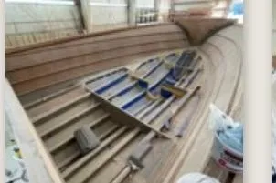 64 Under Construction Yacht Photos Pics 2026 Weaver Sportfish boat under construction in a workshop.