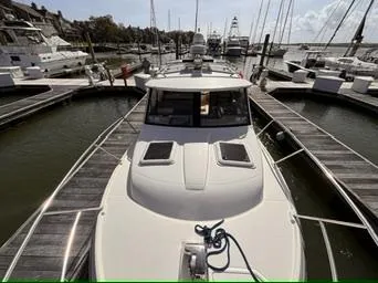 Seahorse Yacht Photos Pics 2016 Cutwater 28 LE docked at a marina, surrounded by other boats.