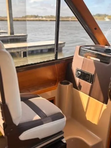 Seahorse Yacht Photos Pics Interior view of 2016 Cutwater 28 LE boat with helm and seating.