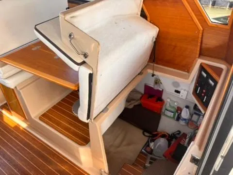 Seahorse Yacht Photos Pics 2016 Cutwater 28 LE interior with wooden flooring and storage compartments.