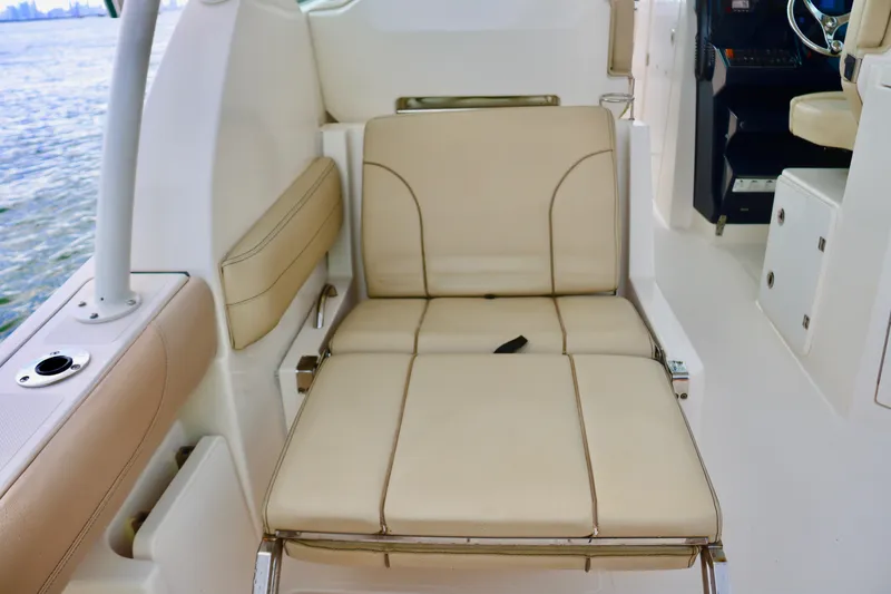  Yacht Photos Pics 2017 Pursuit DC 295 Dual Console boat interior with beige seating.