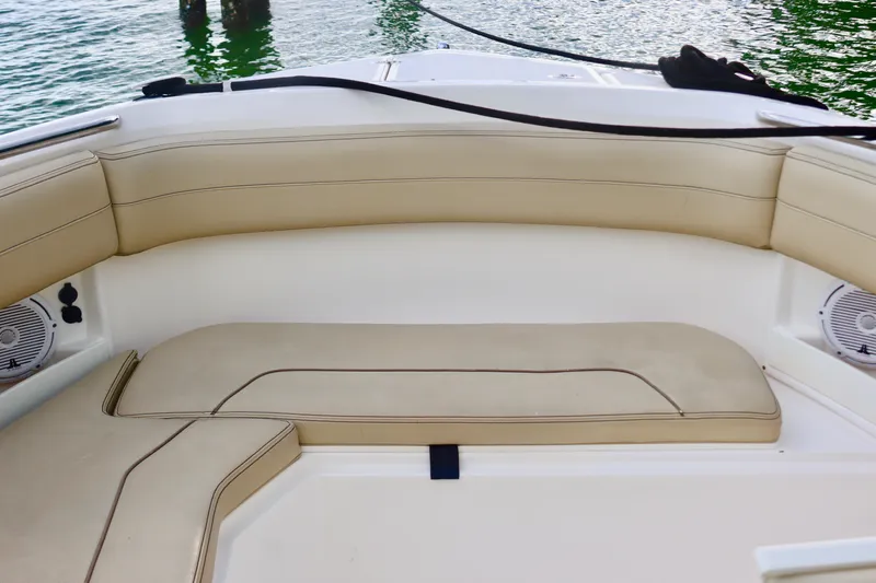  Yacht Photos Pics 2017 Pursuit DC 295 Dual Console boat with beige seating and water view.