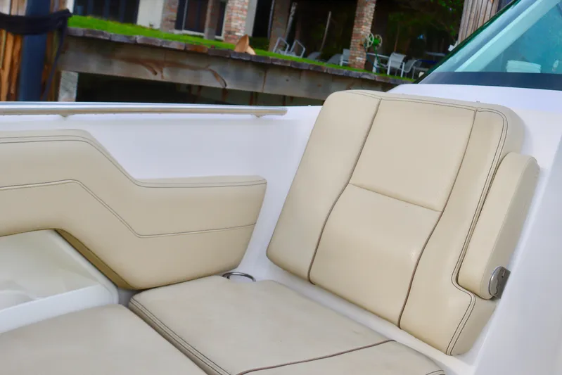  Yacht Photos Pics 2017 Pursuit DC 295 Dual Console boat with beige seating.