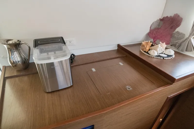 Benedetto Yacht Photos Pics Interior of 2020 Lagoon 42 yacht with ice maker and decorative seashells.