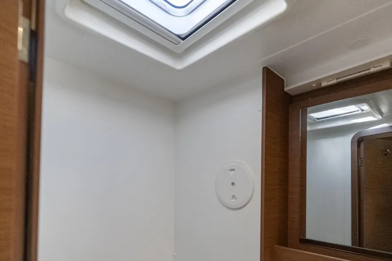 Benedetto Yacht Photos Pics Interior of 2020 Lagoon 42 yacht bathroom with skylight and mirror.