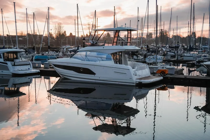  Yacht Photos Pics 2024 Prestige 420 yacht docked at a marina during sunset.
