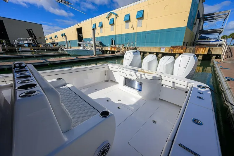 Fishability Yacht Photos Pics 2025 Valhalla Boatworks V-41 at dock, showcasing spacious deck and powerful engines.