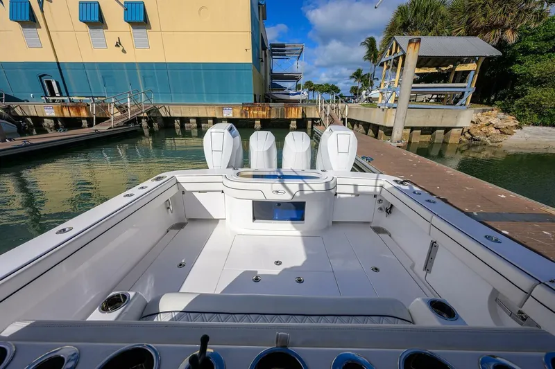 Fishability Yacht Photos Pics 2025 Valhalla Boatworks V-41 at dock, showcasing spacious deck and triple engines.