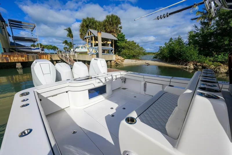 Fishability Yacht Photos Pics 2025 Valhalla Boatworks V-41, spacious deck, docked near tropical shoreline.