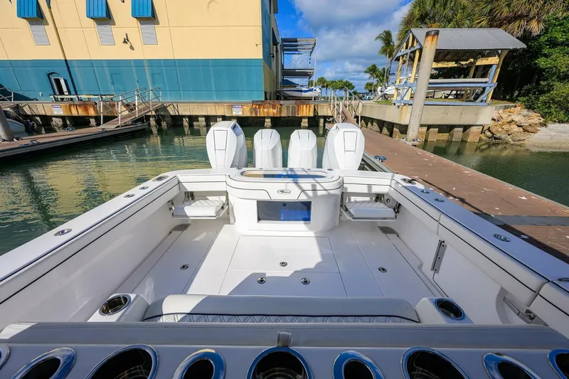 Fishability Yacht Photos Pics 2025 Valhalla Boatworks V-41 at dock, showcasing spacious deck and triple engines.