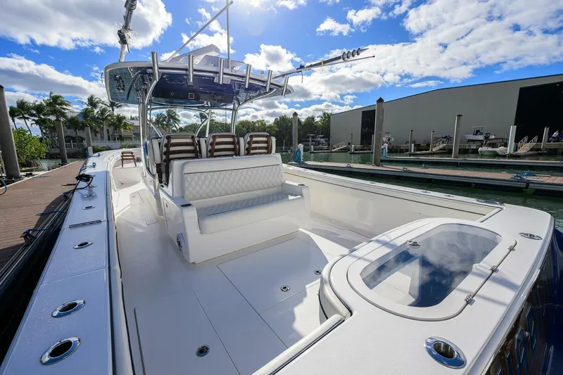 Fishability Yacht Photos Pics 2025 Valhalla Boatworks V-41 luxury boat docked under a sunny sky.