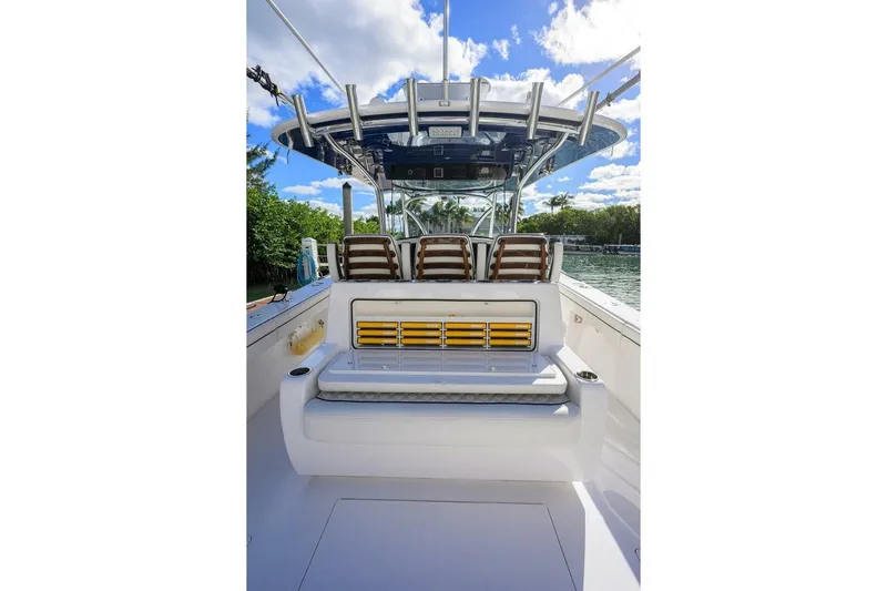 Fishability Yacht Photos Pics 2025 Valhalla Boatworks V-41 interior with seating and helm, under clear blue sky.