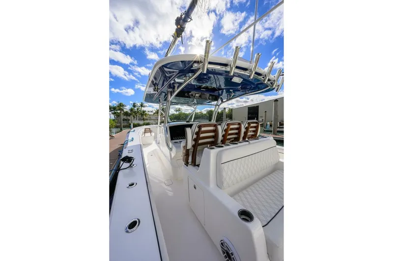 Fishability Yacht Photos Pics 2025 Valhalla Boatworks V-41 interior with seating, sleek design, and clear blue sky.