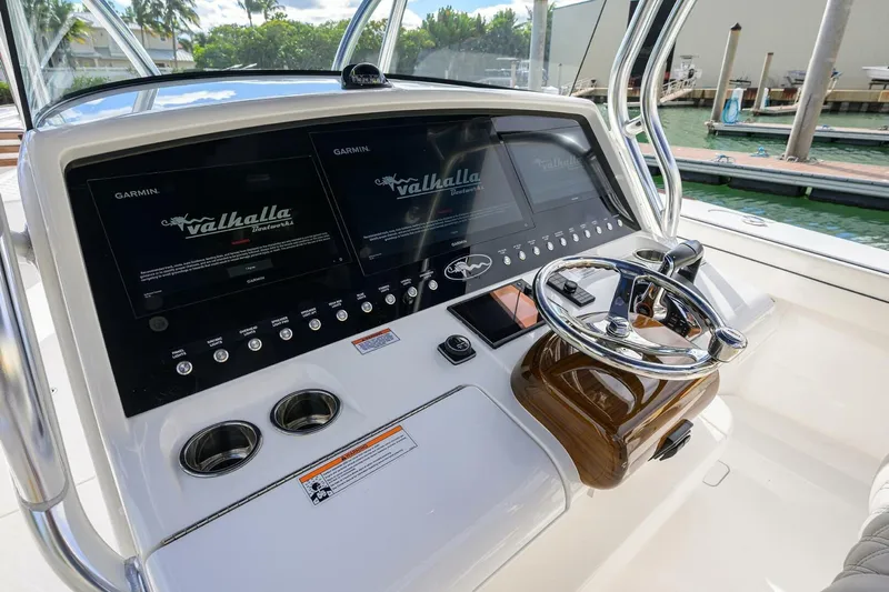 Fishability Yacht Photos Pics 2025 Valhalla Boatworks V-41 helm with dual Garmin displays and sleek steering wheel.