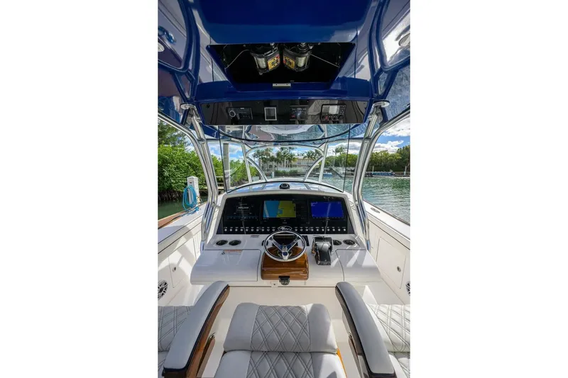 Fishability Yacht Photos Pics 2025 Valhalla Boatworks V-41 helm with advanced navigation system and luxurious seating.