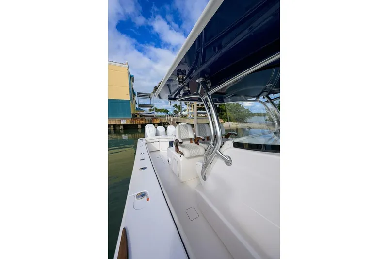 Fishability Yacht Photos Pics 2025 Valhalla Boatworks V-41, sleek design, docked in marina under blue sky.