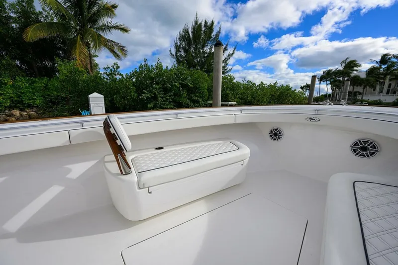 Fishability Yacht Photos Pics 2025 Valhalla Boatworks V-41 interior with white seating, lush greenery, and blue sky background.