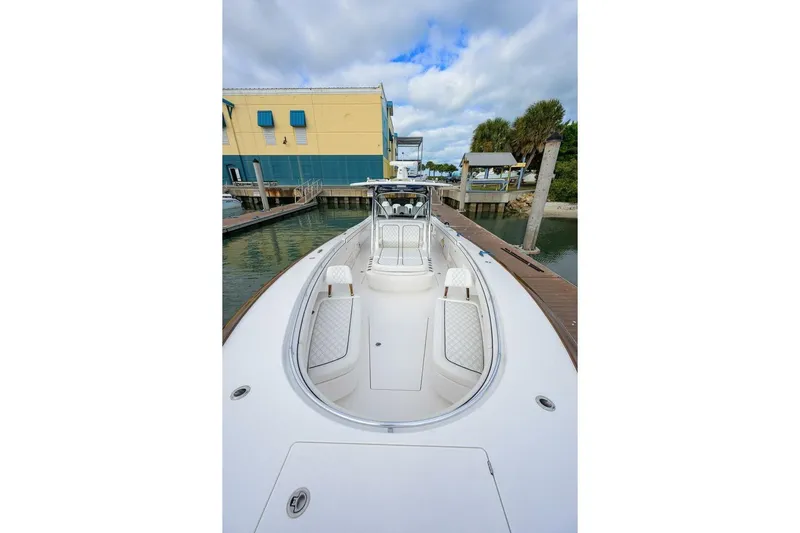 Fishability Yacht Photos Pics 2025 Valhalla Boatworks V-41 docked, showcasing sleek design and spacious deck.