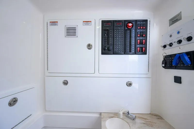 Fishability Yacht Photos Pics 2025 Valhalla Boatworks V-41 control panel with switches and keys in a sleek interior.