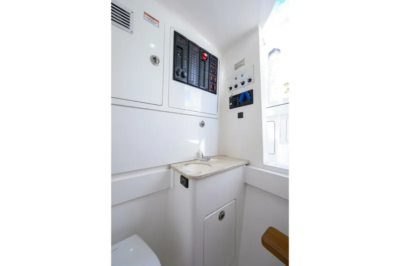 Fishability Yacht Photos Pics 2025 Valhalla Boatworks V-41 interior with control panels and sink.