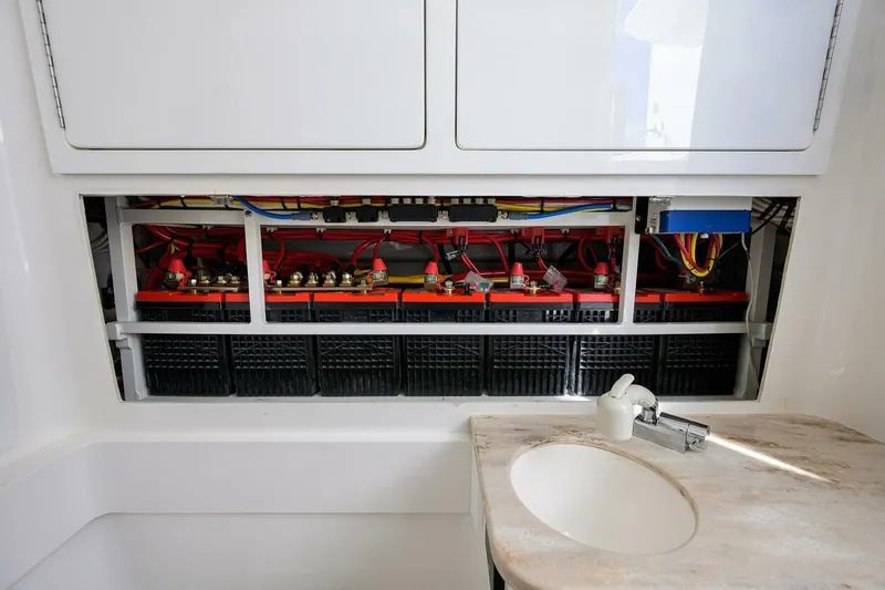 Fishability Yacht Photos Pics 2025 Valhalla Boatworks V-41 interior showing battery compartment and sink area.