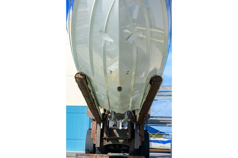 Fishability Yacht Photos Pics 2025 Valhalla Boatworks V-41 hull on lift, showcasing sleek design and craftsmanship.