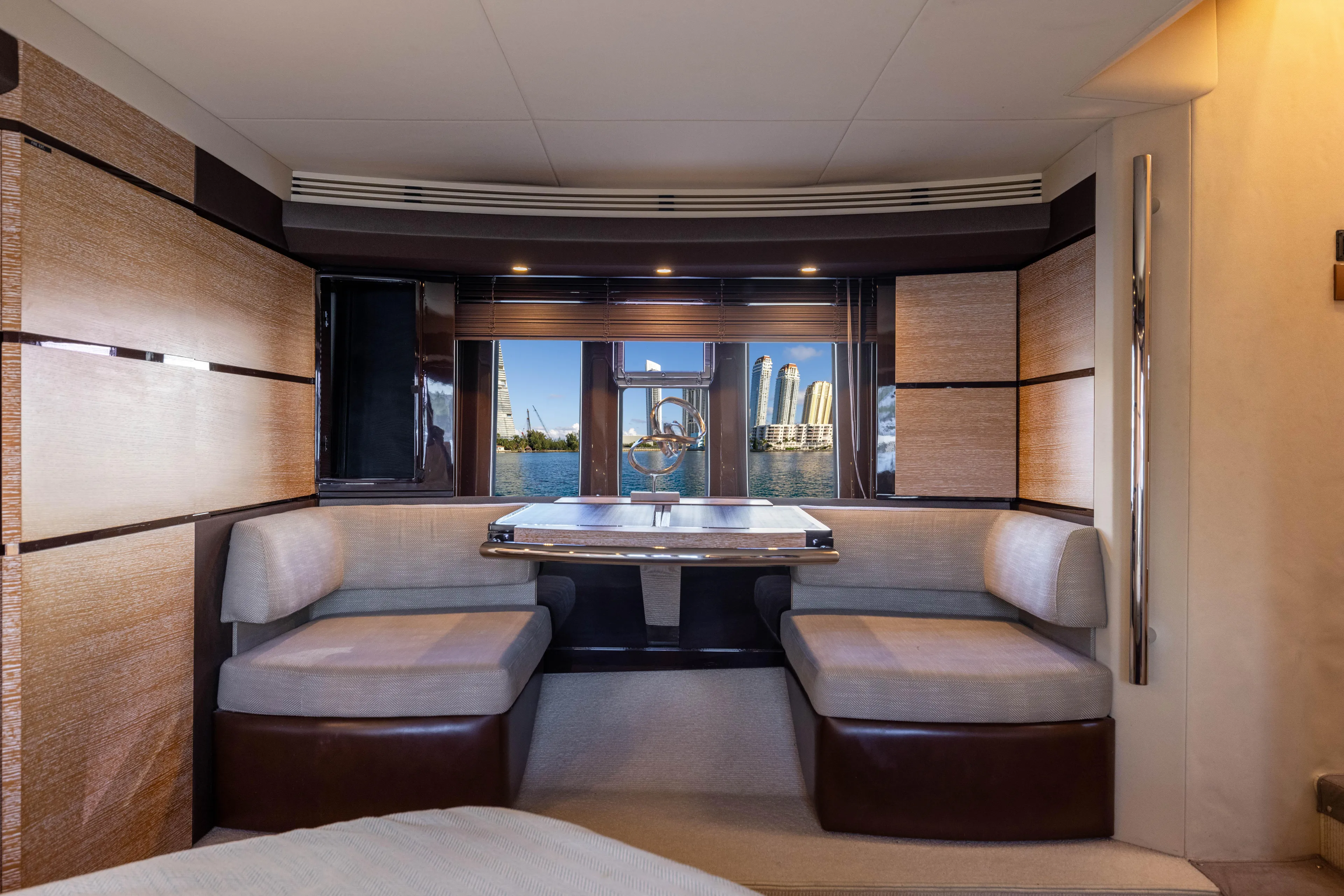 Blue Sea Yacht Photos Pics Luxurious interior of 2012 Azimut 53 yacht with elegant seating and scenic window view.