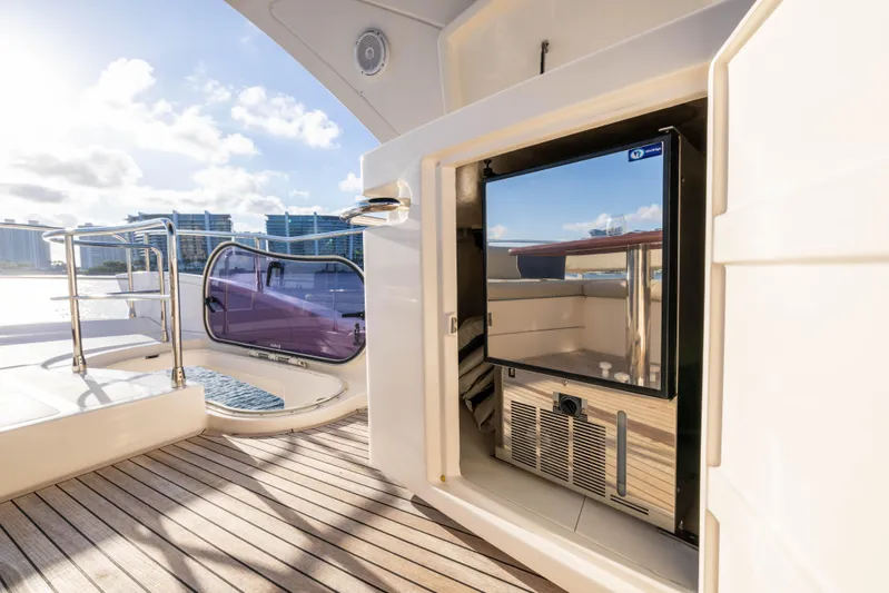 Blue Sea Yacht Photos Pics Luxury Azimut 53 yacht deck with built-in refrigerator, 2012 model, sunny waterfront view.