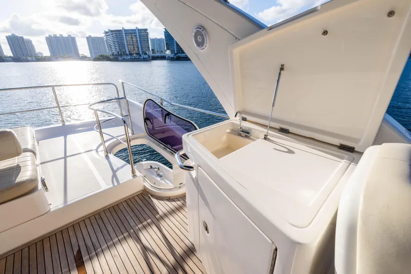 Blue Sea Yacht Photos Pics Luxurious 2012 Azimut 53 yacht deck with sink, overlooking waterfront cityscape.
