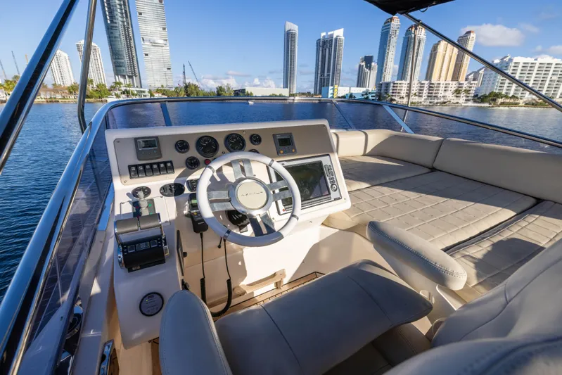 Blue Sea Yacht Photos Pics Helm of 2012 Azimut 53 yacht with city skyline in background.