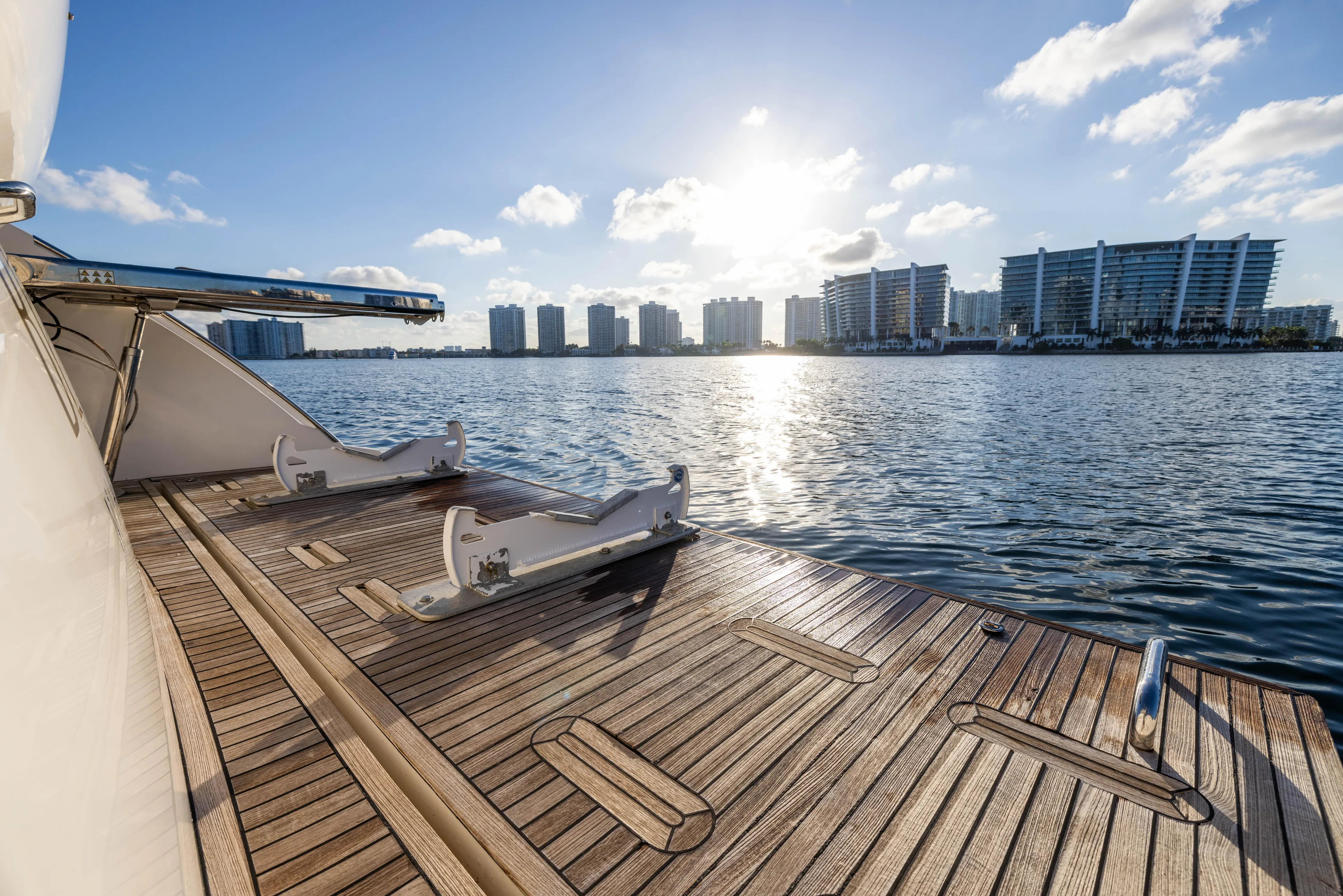 Blue Sea Yacht Photos Pics Azimut 53 yacht deck with waterfront cityscape, 2012 model, sunny day.