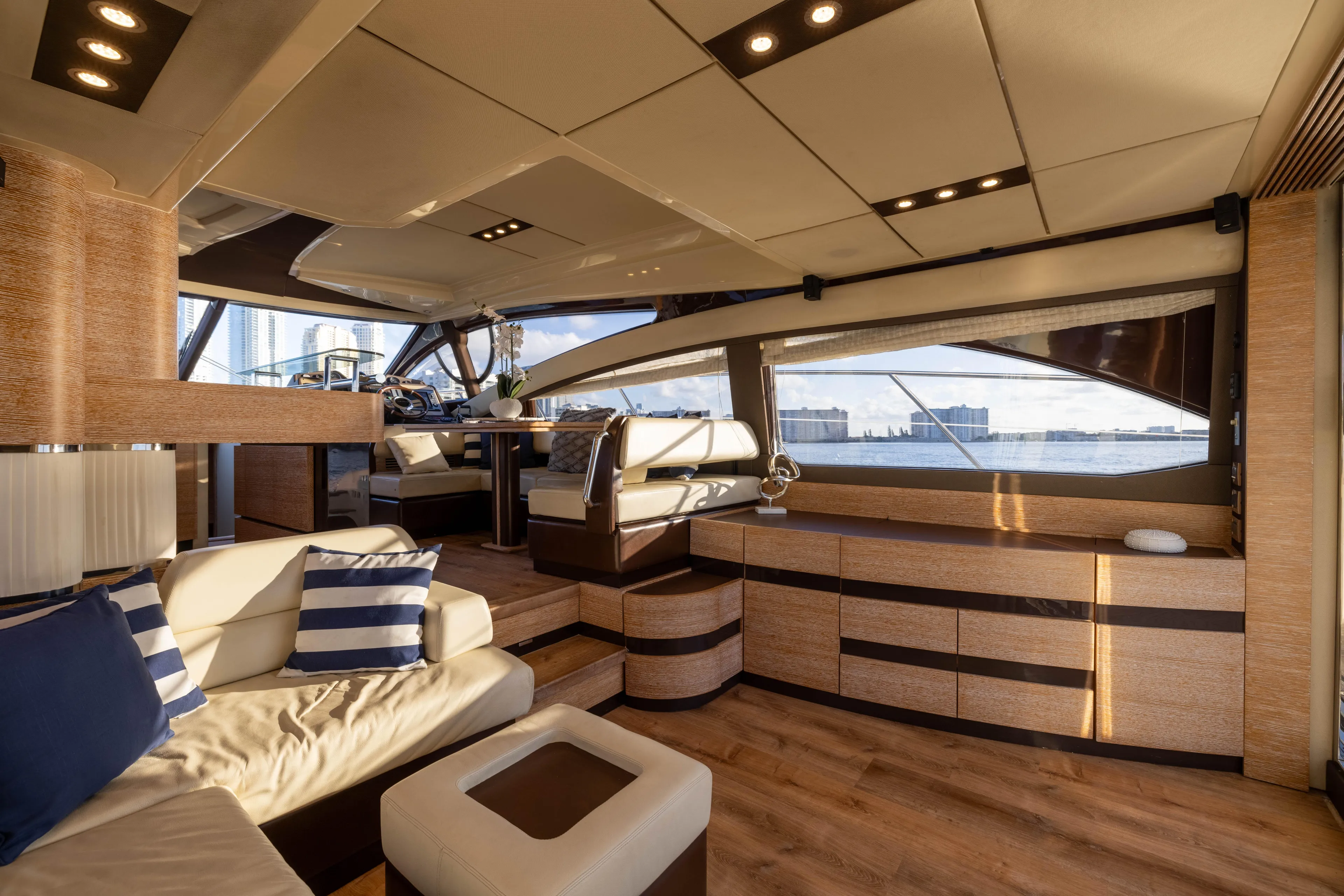 Blue Sea Yacht Photos Pics Luxurious interior of a 2012 Azimut 53 yacht with elegant seating and panoramic windows.