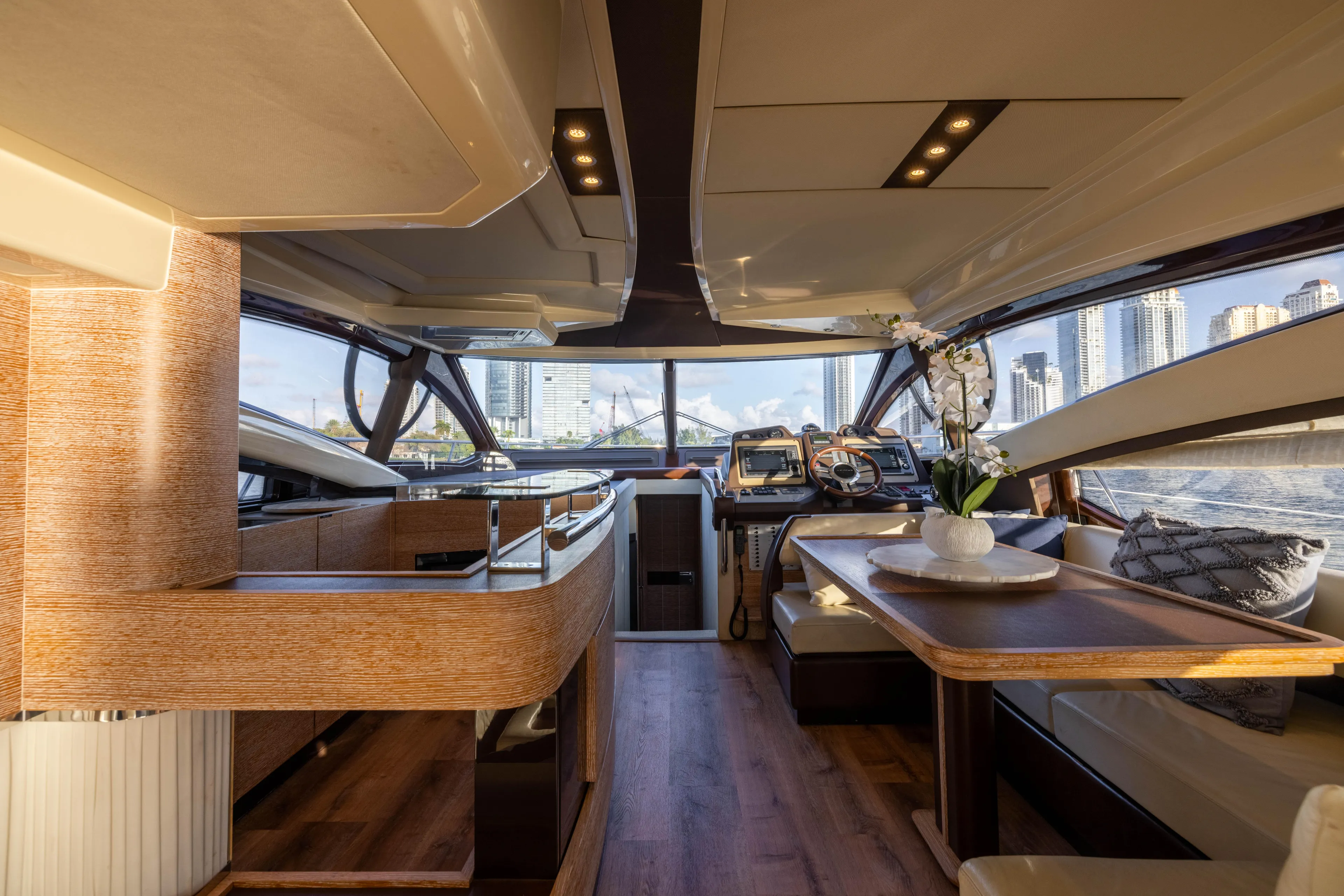 Blue Sea Yacht Photos Pics Luxurious interior of a 2012 Azimut 53 yacht with modern furnishings and cityscape view.