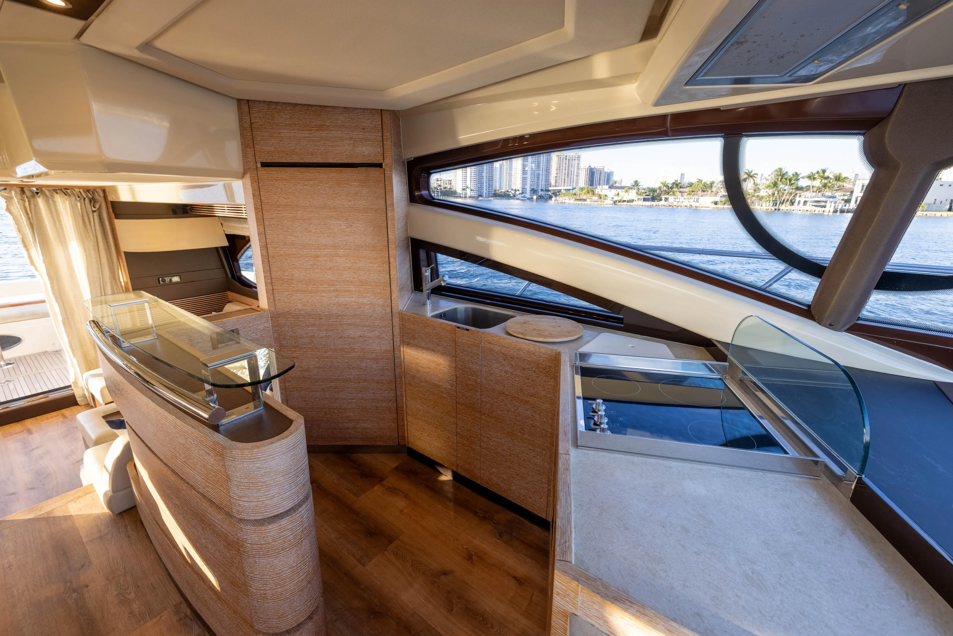 Blue Sea Yacht Photos Pics Luxurious interior of a 2012 Azimut 53 yacht with modern design and waterfront view.