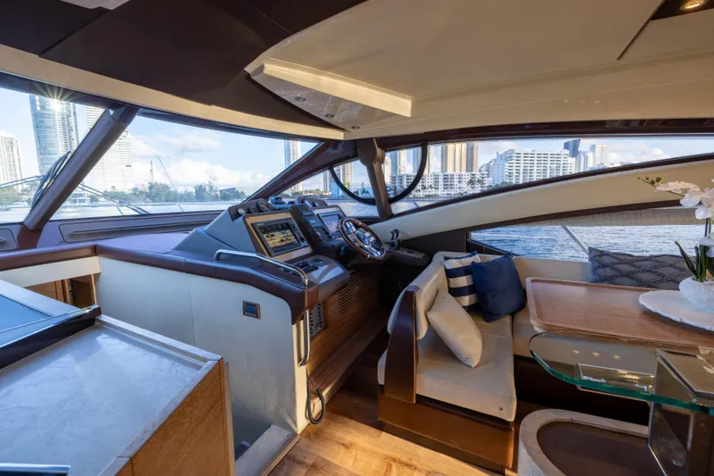Blue Sea Yacht Photos Pics Luxurious interior of a 2012 Azimut 53 yacht with modern helm and seating area.