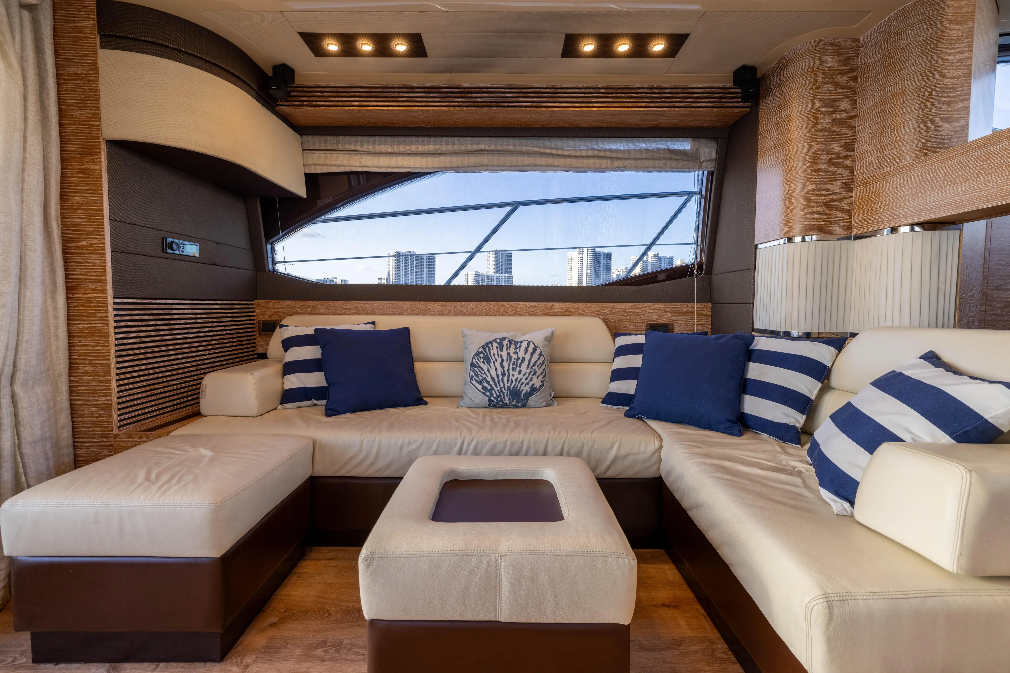 Blue Sea Yacht Photos Pics Luxurious interior of 2012 Azimut 53 yacht with elegant seating and nautical-themed cushions.