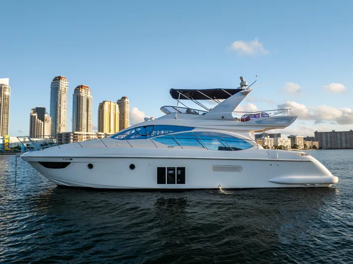 Blue Sea Yacht Photos Pics 2012 Azimut 53 yacht on water with city skyline in background.