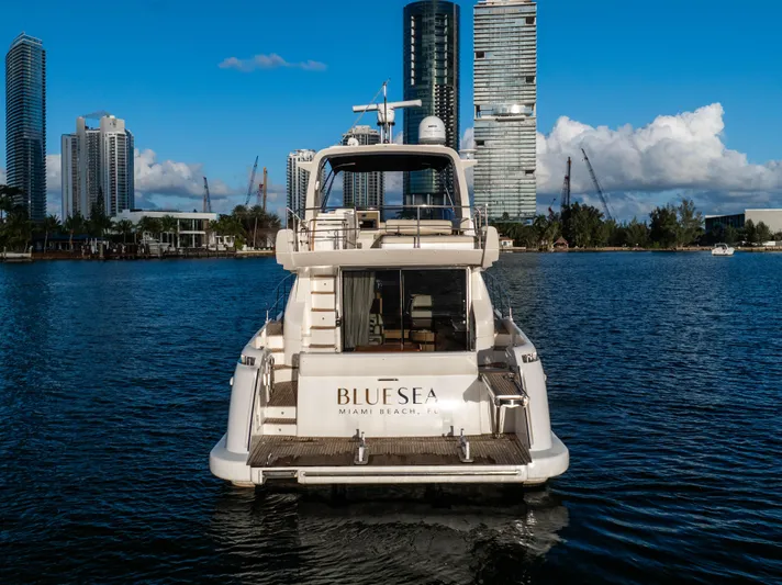 Blue Sea Yacht Photos Pics Azimut 53 yacht on water with city skyline, 2012 model.