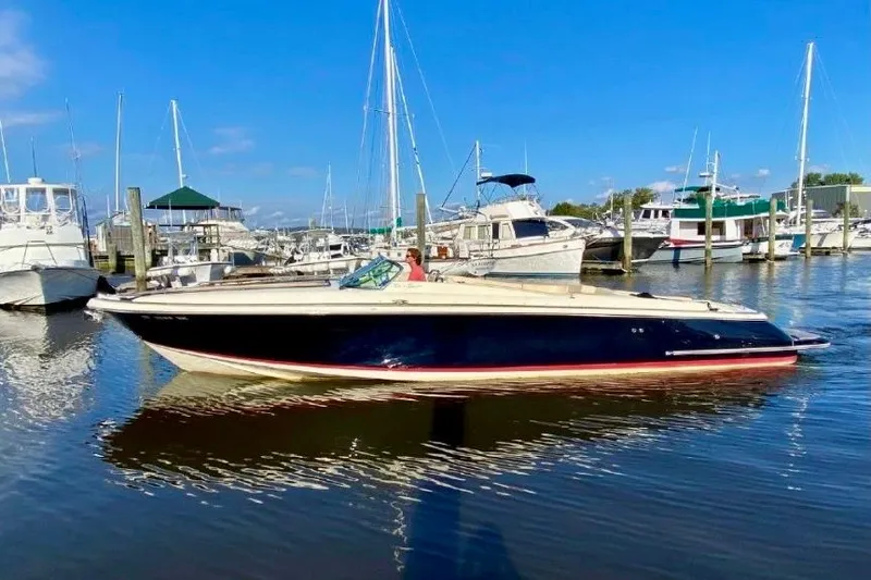  Yacht Photos Pics 2016 Chris-Craft Corsair 32 boat docked in a marina under clear blue skies.