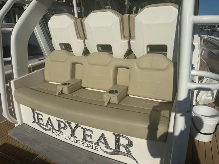Leap Year Yacht Photos Pics 2018 Pursuit 408S boat seating with "Leap Year" Fort Lauderdale branding.