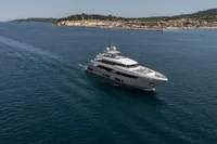 Luxurious 2022 Custom Line 37 yacht cruising near scenic coastline.