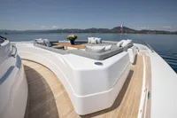 Luxurious 2022 Custom Line 37 yacht deck with elegant seating and scenic ocean view.